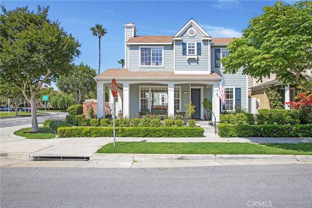 2 Hydrangea St, Ladera Ranch, CA 92694 - view of front of property featuring a porch and a chimney