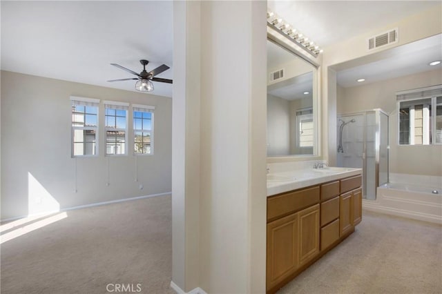 2 Hydrangea St, Ladera Ranch, CA 92694 - full bath featuring a shower stall, double vanity, a bath, ceiling fan, and baseboards