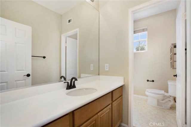 2 Hydrangea St, Ladera Ranch, CA 92694 - bathroom with toilet, vanity, and baseboards