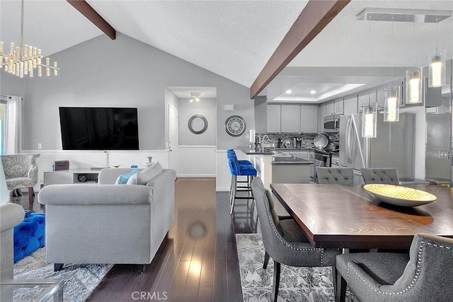 44 Carriage Way Unit 108, Pomona, CA 91766 - dining room featuring dark wood-style floors and a chandelier