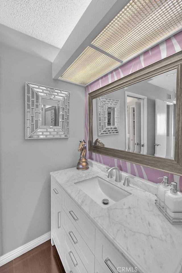 44 Carriage Way Unit 108, Pomona, CA 91766 - bathroom featuring vanity and baseboards