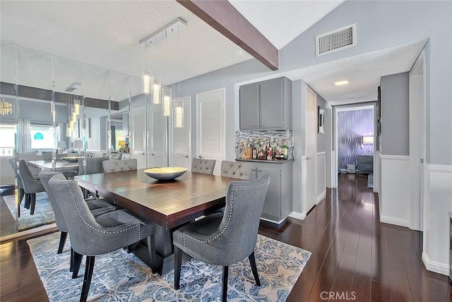 44 Carriage Way Unit 108, Pomona, CA 91766 - dining area with a textured ceiling, dark wood finished floors, and lofted ceiling