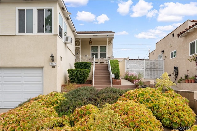 2917 W Hellman Ave, Alhambra, CA 91803 - view of front of property featuring stucco siding, stairs, and a garage