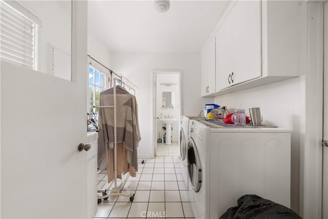 2917 W Hellman Ave, Alhambra, CA 91803 - laundry room featuring washing machine and dryer, cabinet space, and light tile patterned flooring