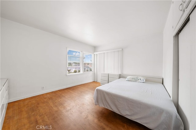 2917 W Hellman Ave, Alhambra, CA 91803 - bedroom featuring light wood-style flooring, baseboards, and a closet