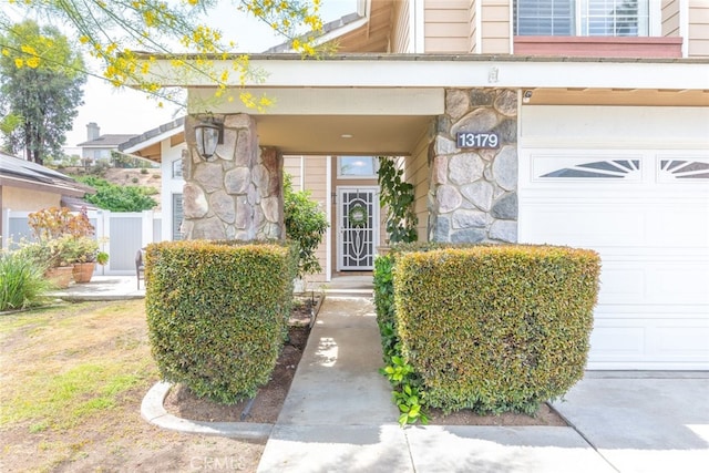 13179 Lone Stallion Ln, Corona, CA 92883 - entrance to property with stone siding and a garage