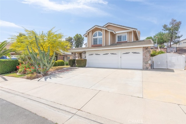 13179 Lone Stallion Ln, Corona, CA 92883 - traditional home featuring a gate, stone siding, concrete driveway, and a garage