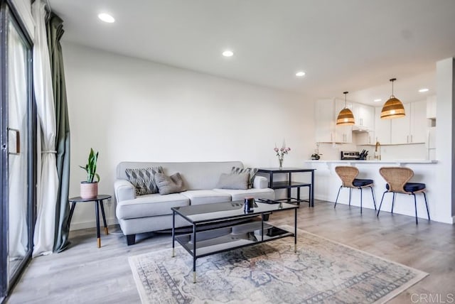 6930 Hyde Park Dr Unit 218, San Diego, CA 92119 - living area featuring light wood-style floors, recessed lighting, and baseboards