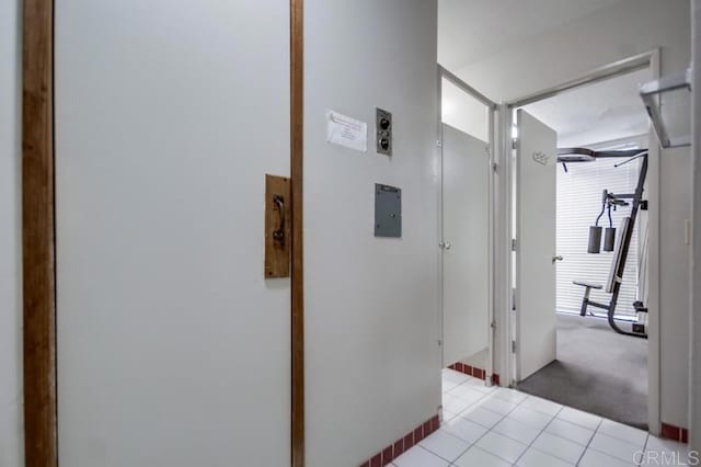 6930 Hyde Park Dr Unit 218, San Diego, CA 92119 - corridor featuring light tile patterned floors and light colored carpet
