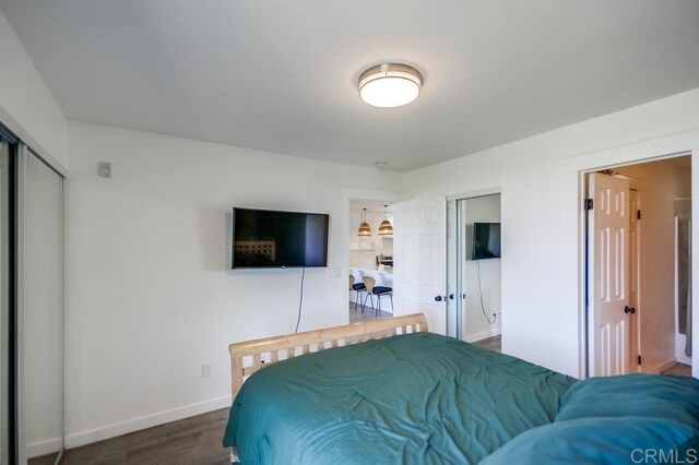 6930 Hyde Park Dr Unit 218, San Diego, CA 92119 - bedroom with dark wood-style floors and baseboards