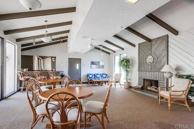 6930 Hyde Park Dr Unit 218, San Diego, CA 92119 - carpeted dining area with a ceiling fan and a fireplace