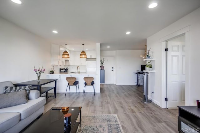 6930 Hyde Park Dr Unit 218, San Diego, CA 92119 - living area featuring light wood finished floors and recessed lighting