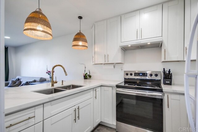 6930 Hyde Park Dr Unit 218, San Diego, CA 92119 - kitchen with stainless steel electric range, under cabinet range hood, a sink, and white cabinets