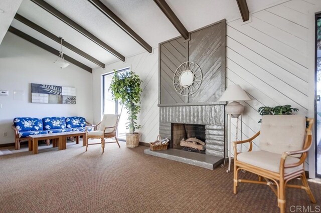 6930 Hyde Park Dr Unit 218, San Diego, CA 92119 - living area with carpet flooring, a fireplace with raised hearth, and wooden walls