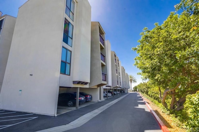 6930 Hyde Park Dr Unit 218, San Diego, CA 92119 - view of building exterior with covered parking