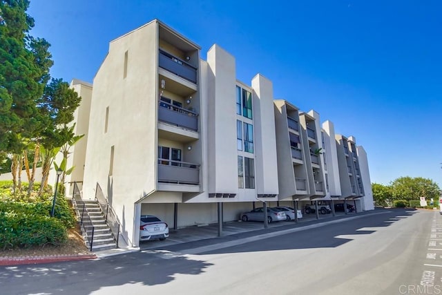 6930 Hyde Park Dr Unit 218, San Diego, CA 92119 - view of apartment building / complex with stairway