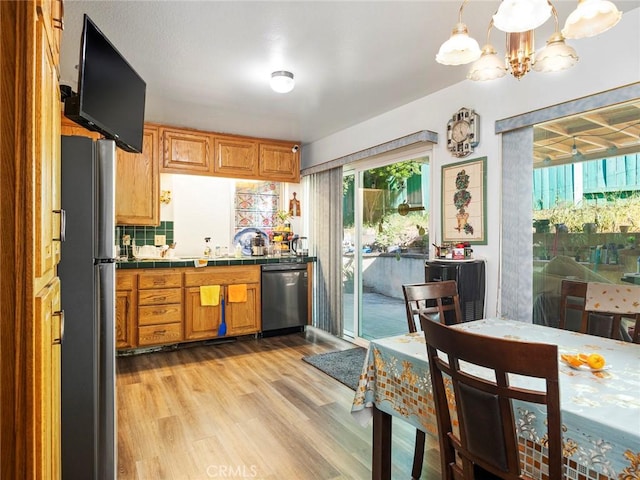 3038 Blakeman Ave, Rowland Heights, CA 91748 - kitchen featuring dishwashing machine, tile countertops, freestanding refrigerator, light wood-type flooring, and a chandelier