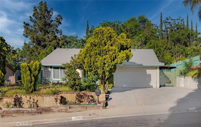 3038 Blakeman Ave, Rowland Heights, CA 91748 - view of property hidden behind natural elements with concrete driveway and an attached garage