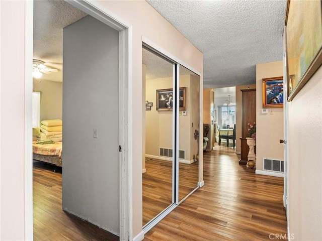 3038 Blakeman Ave, Rowland Heights, CA 91748 - hall with a textured ceiling, wood finished floors, and baseboards