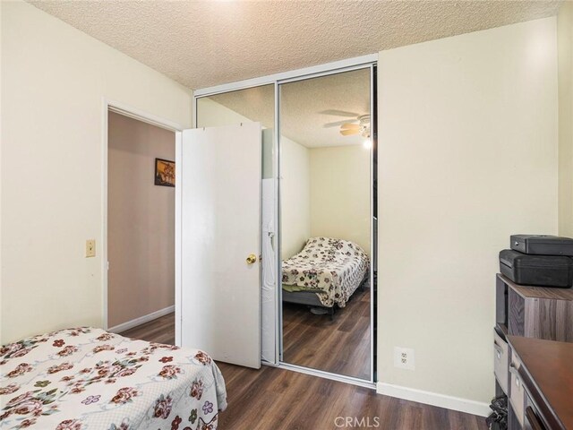 3038 Blakeman Ave, Rowland Heights, CA 91748 - bedroom featuring a closet, dark wood finished floors, a textured ceiling, and baseboards