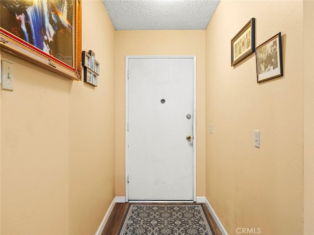 3038 Blakeman Ave, Rowland Heights, CA 91748 - entryway with wood finished floors, a textured ceiling, and baseboards