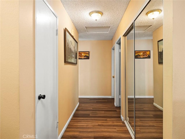 3038 Blakeman Ave, Rowland Heights, CA 91748 - hall featuring dark wood-style flooring, a textured ceiling, baseboards, and attic access