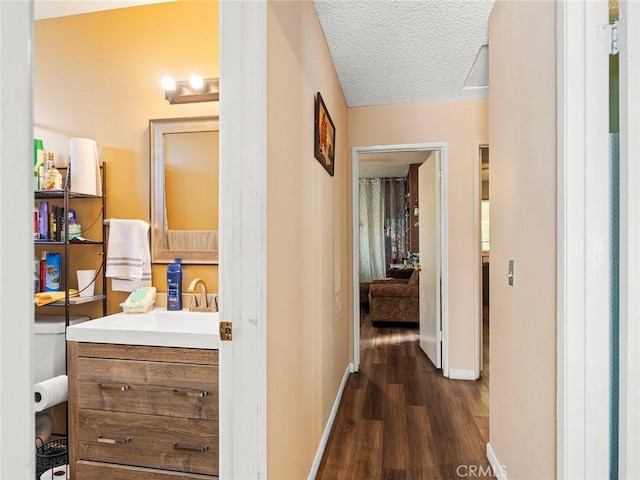 3038 Blakeman Ave, Rowland Heights, CA 91748 - hallway with dark wood-style flooring, baseboards, and a textured ceiling