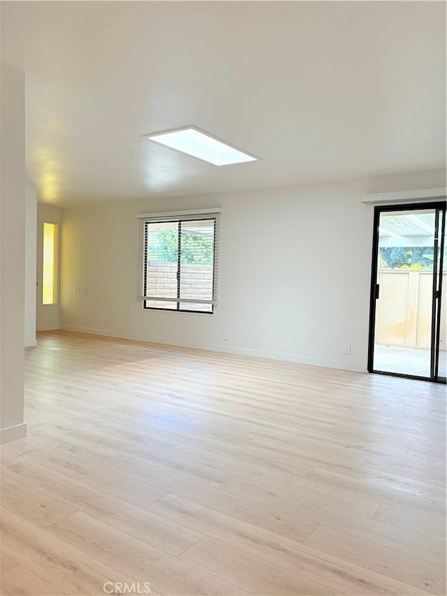 3088 Via Serena N Unit D, Laguna Woods, CA 92637 - empty room featuring healthy amount of natural light, a skylight, and light wood-style floors