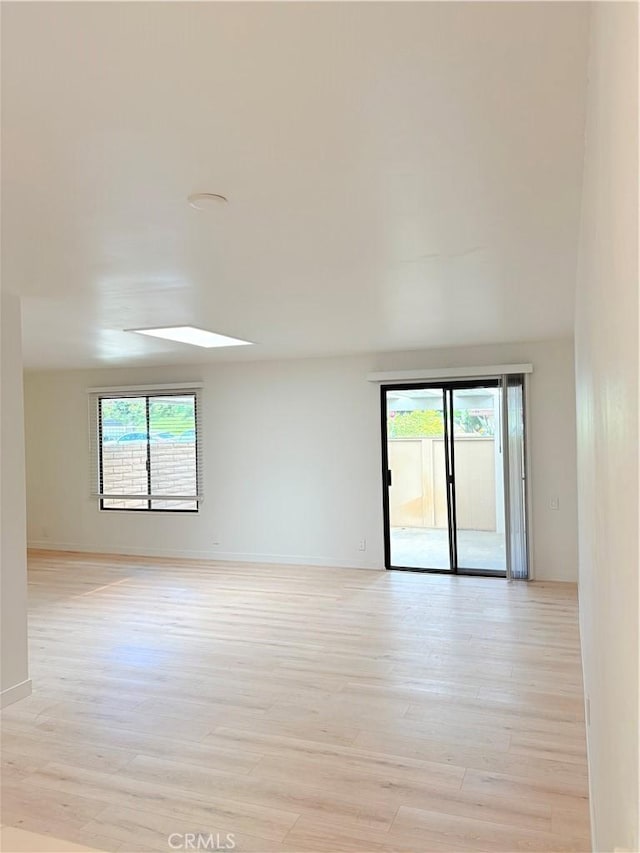 3088 Via Serena N Unit D, Laguna Woods, CA 92637 - spare room featuring healthy amount of natural light, light wood-style floors, and baseboards