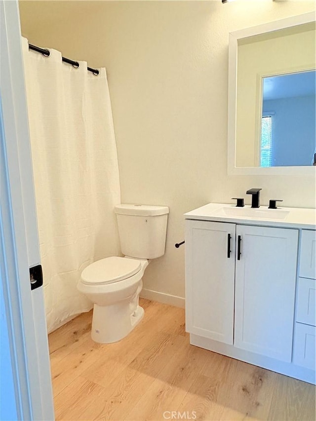 3088 Via Serena N Unit D, Laguna Woods, CA 92637 - full bath with wood finished floors, toilet, vanity, and curtained shower