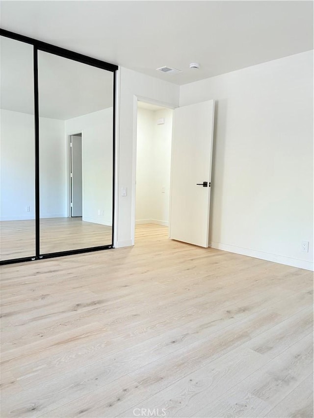 3088 Via Serena N Unit D, Laguna Woods, CA 92637 - unfurnished bedroom featuring light wood-style flooring and baseboards
