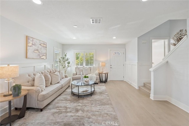 7 Monticello Ln, Rancho Santa Margarita, CA 92688 - living area featuring wood finished floors, a decorative wall, recessed lighting, stairway, and a wainscoted wall