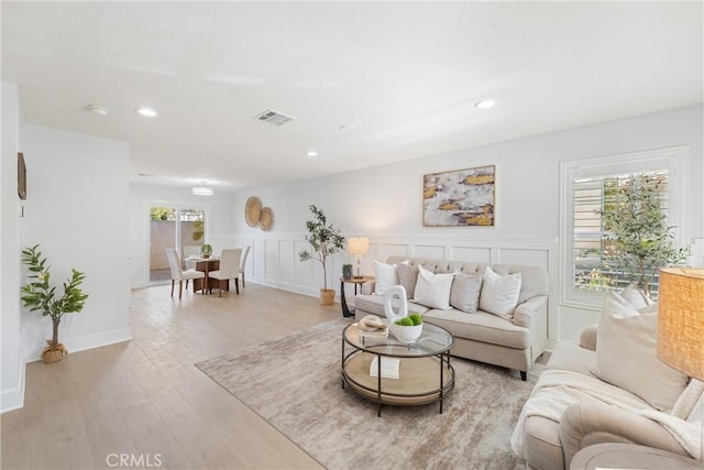 7 Monticello Ln, Rancho Santa Margarita, CA 92688 - living room with light wood finished floors, recessed lighting, a decorative wall, and a wainscoted wall