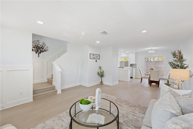 7 Monticello Ln, Rancho Santa Margarita, CA 92688 - living room with light wood-type flooring, stairs, a wainscoted wall, and recessed lighting