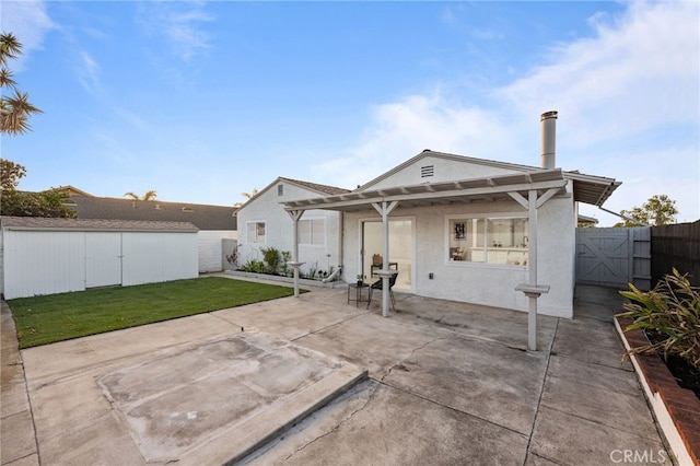 1086 Amacayo Ct, San Diego, CA 92154 - back of house featuring a patio area, stucco siding, a pergola, and an outbuilding