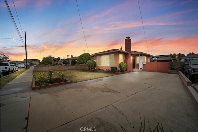 2034 W 165th St, Torrance, CA 90504 - view of front of house featuring a chimney, stucco siding, and a gate