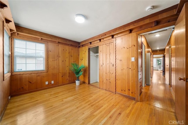 2034 W 165th St, Torrance, CA 90504 - unfurnished bedroom featuring light wood-style floors, wood walls, a closet, and baseboards