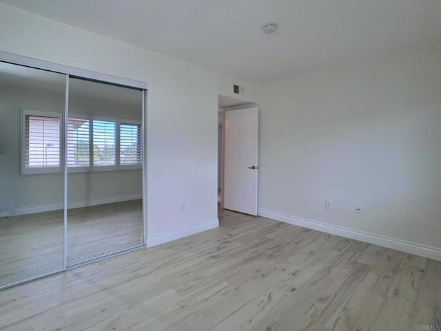 6808 Hyde Park Dr, San Diego, CA 92119 - unfurnished bedroom featuring light wood finished floors, a closet, and baseboards