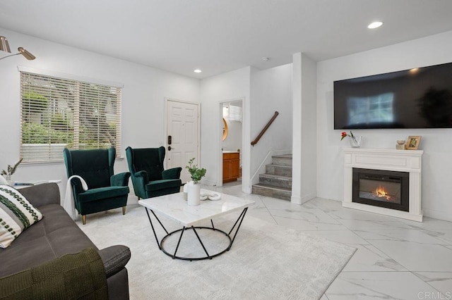 5529 Old Ranch Rd Unit 47, Oceanside, CA 92057 - living area featuring light marble finish floors, recessed lighting, stairway, and a glass covered fireplace
