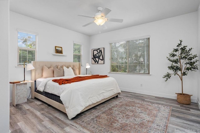 5529 Old Ranch Rd Unit 47, Oceanside, CA 92057 - bedroom with wood finished floors, baseboards, and ceiling fan