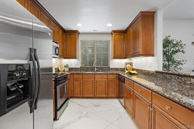 5529 Old Ranch Rd Unit 47, Oceanside, CA 92057 - kitchen featuring appliances with stainless steel finishes, a sink, light marble finish flooring, brown cabinetry, and recessed lighting