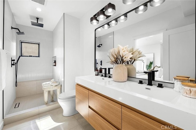 957 Everett St, Los Angeles, CA 90026 - bathroom featuring tile patterned floors, double vanity, a tile shower, and toilet