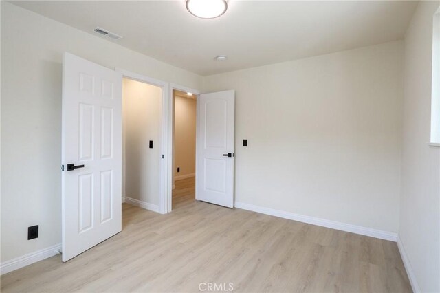 18479 Aguiro St, Rowland Heights, CA 91748 - unfurnished bedroom featuring light wood-type flooring and baseboards
