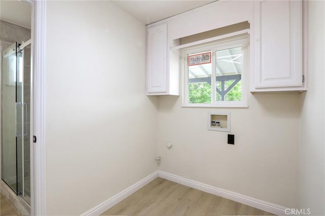 18479 Aguiro St, Rowland Heights, CA 91748 - washroom with cabinet space, hookup for a washing machine, light wood-style flooring, baseboards, and electric dryer hookup