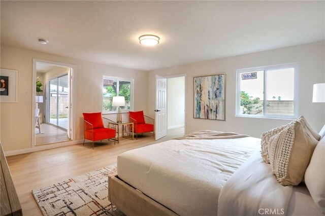 18479 Aguiro St, Rowland Heights, CA 91748 - bedroom with light wood-style flooring, access to outside, and baseboards