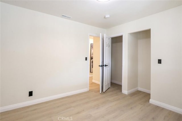18479 Aguiro St, Rowland Heights, CA 91748 - unfurnished bedroom with baseboards and light wood-style flooring