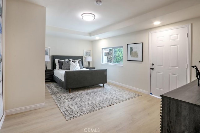 18479 Aguiro St, Rowland Heights, CA 91748 - bedroom featuring light wood-style flooring, baseboards, recessed lighting, and a tray ceiling