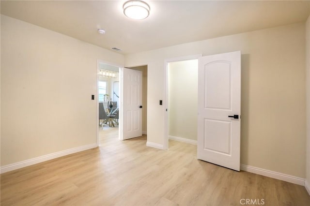 18479 Aguiro St, Rowland Heights, CA 91748 - empty room featuring light wood-style floors, baseboards, and a smoke detector