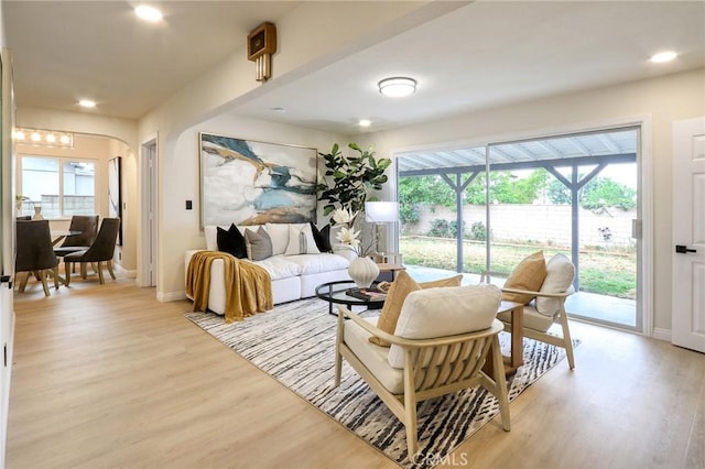 18479 Aguiro St, Rowland Heights, CA 91748 - living area featuring light wood-style flooring, arched walkways, baseboards, and recessed lighting