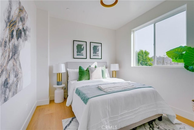 712 N Chestnut Ave, Los Angeles, CA 90042 - bedroom featuring wood finished floors and baseboards
